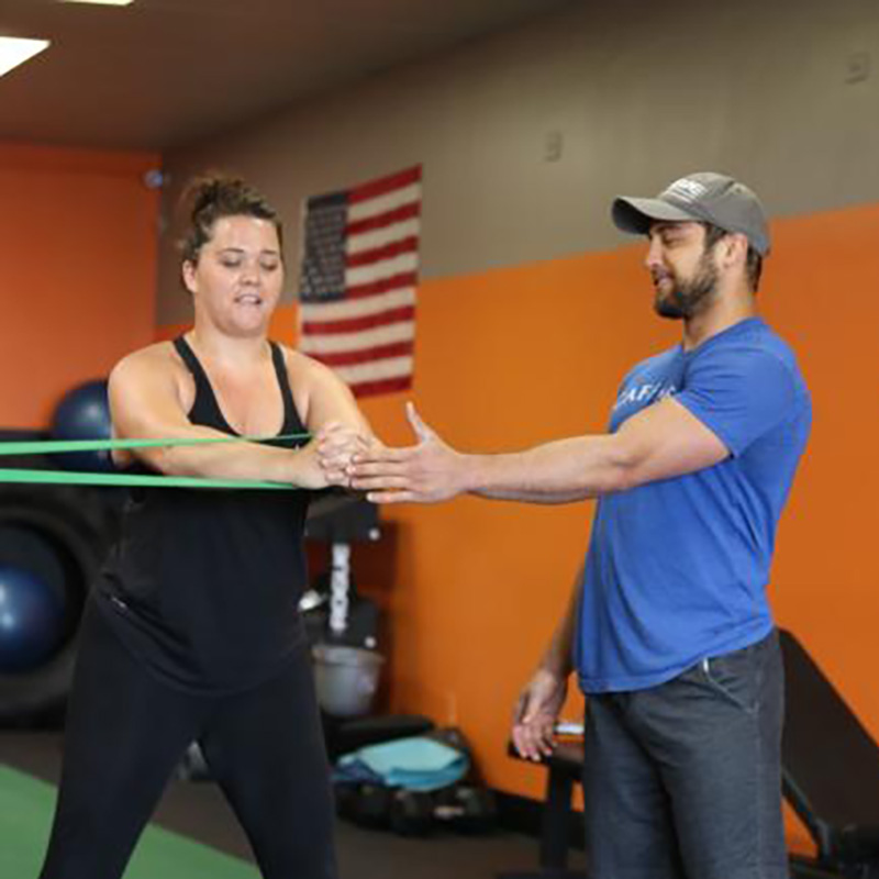 Coach working with a client at Wallace Fitness Center