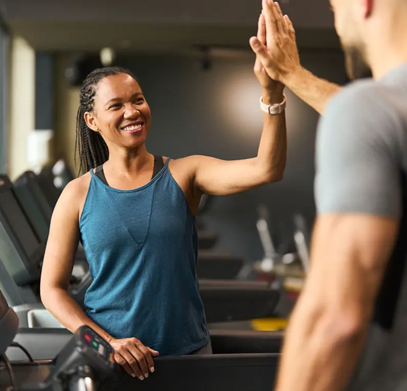 A Wallace Fitness Center member smiling after training