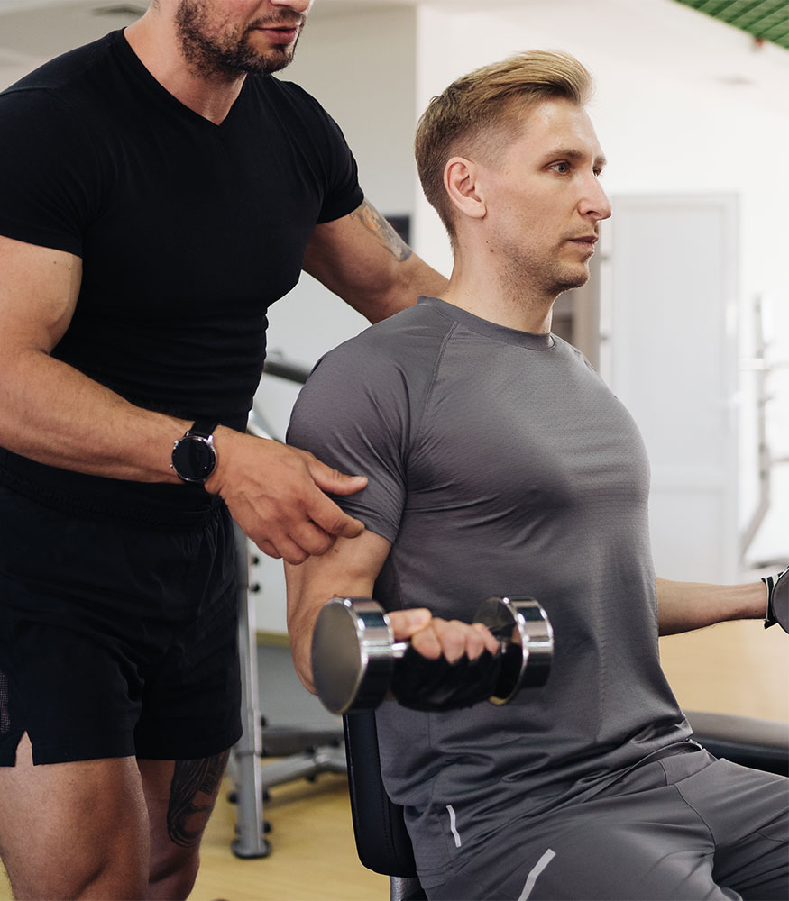 A Wallace Fitness Center coach working one on one with a client during a training session