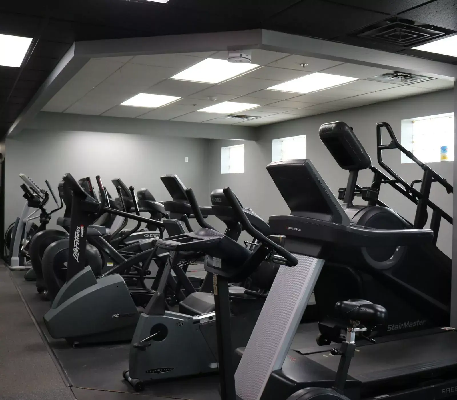 Wallace Fitness Center cardio area with treadmills, ellipticals, and StairMaster machines
