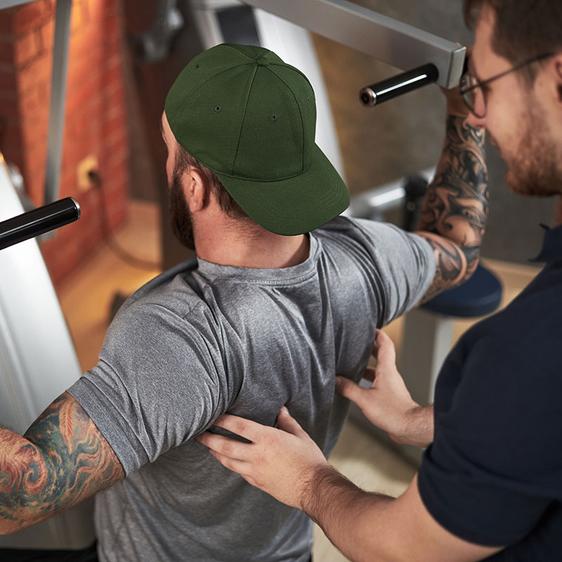 A Wallace Fitness Center coach working one on one with a client during a personal training session